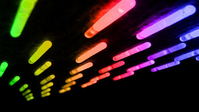 Colorful glow sticks in motion