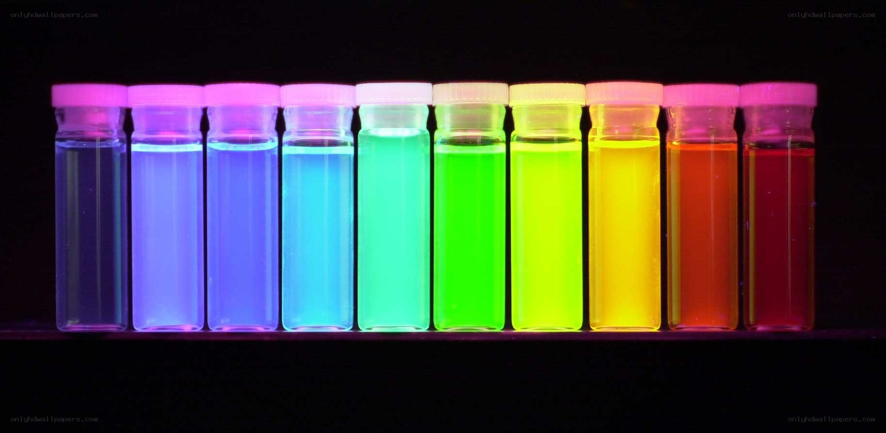 Colorful glowing liquids in vials