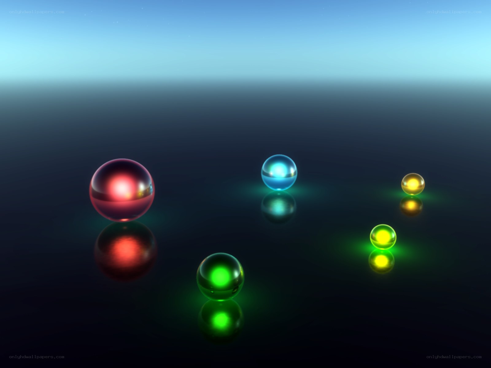 Colorful glowing spheres on dark surface