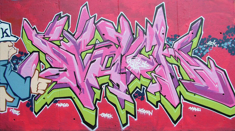 colorful graffiti art on red wall