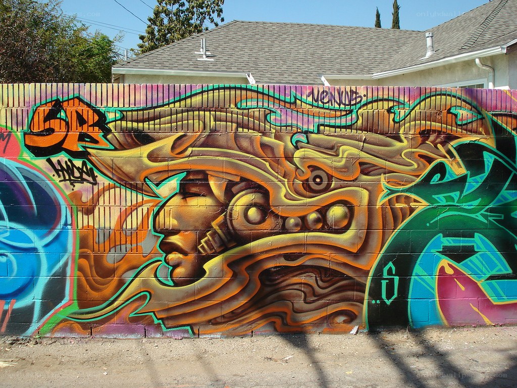 colorful graffiti mural on brick wall