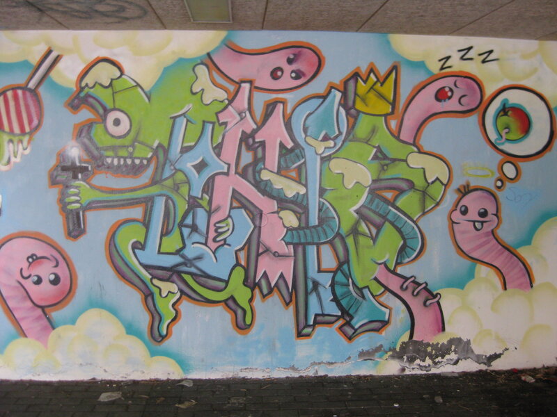 colorful graffiti mural with cartoon characters