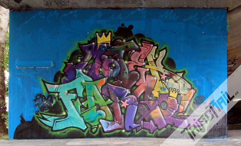 colorful graffiti on blue wall
