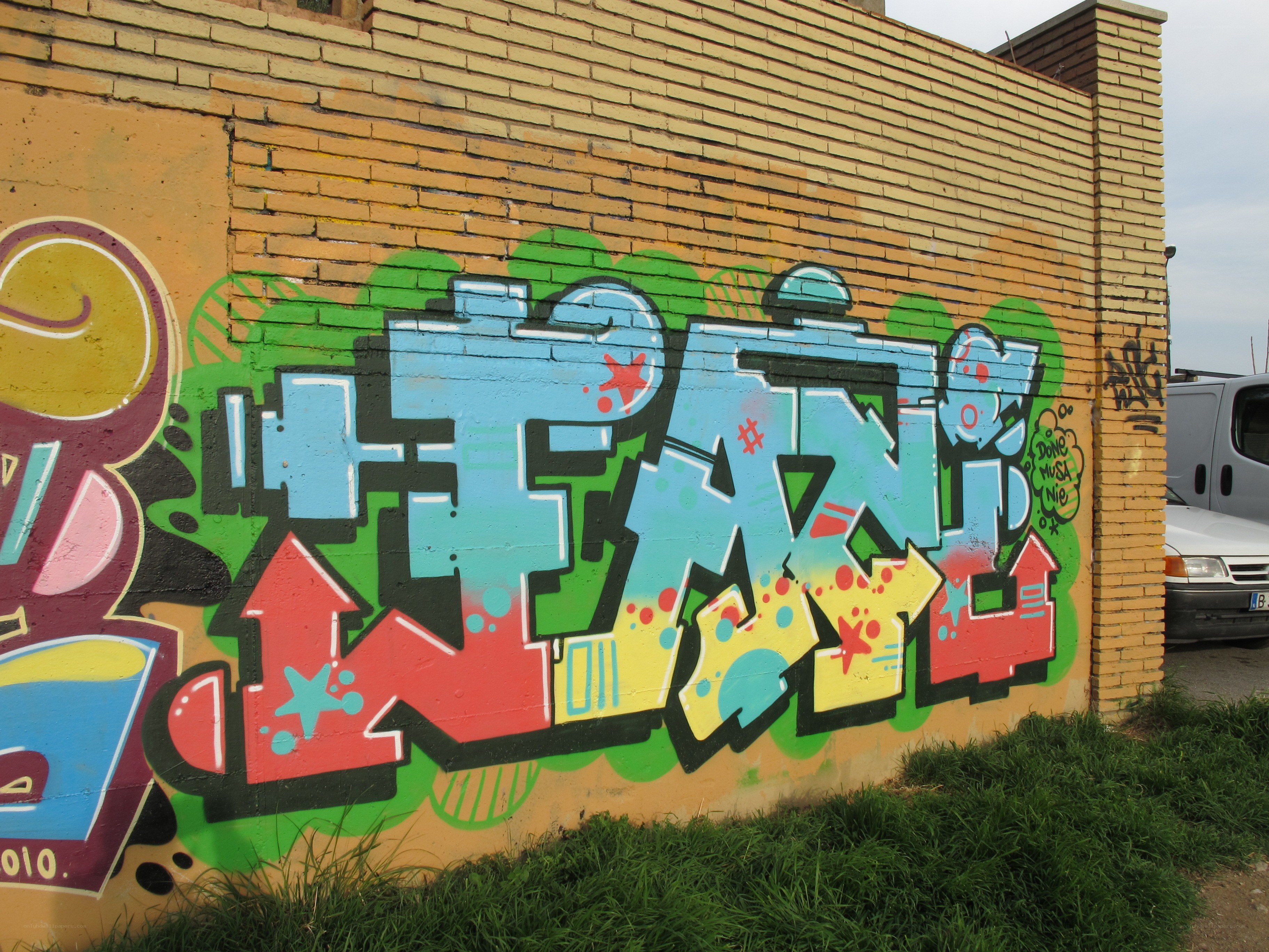 colorful graffiti on brick wall