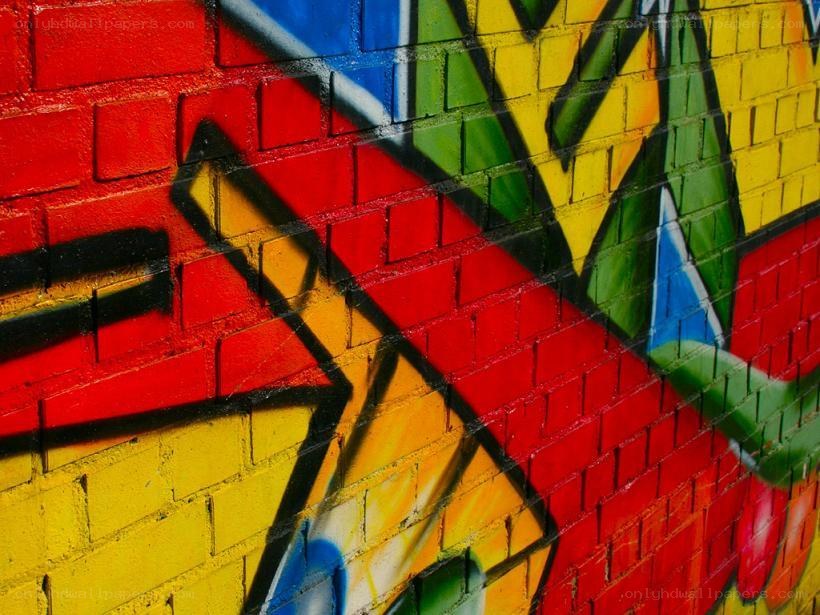 colorful graffiti on brick wall