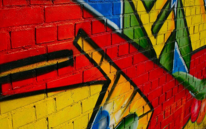 colorful graffiti on brick wall