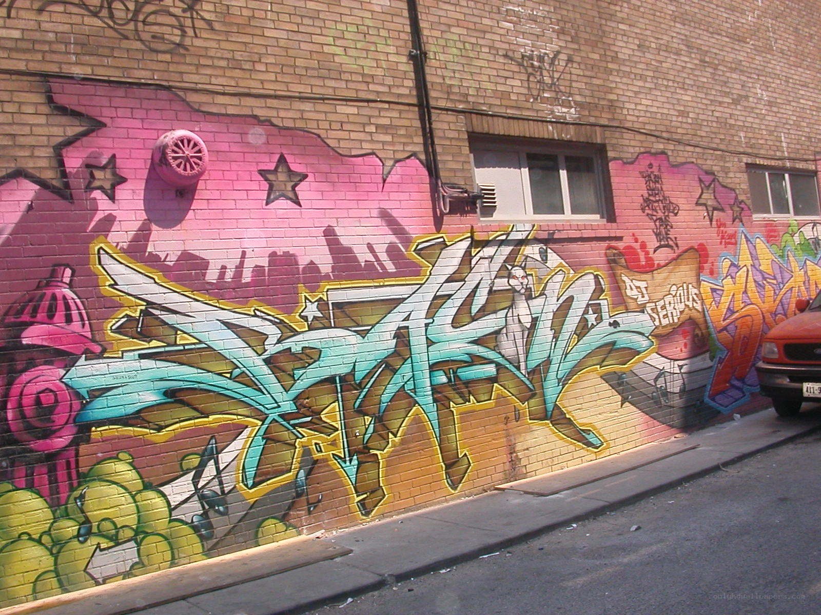 colorful graffiti on brick wall
