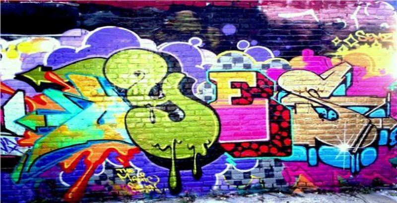 Colorful Graffiti on Brick Wall — Purple