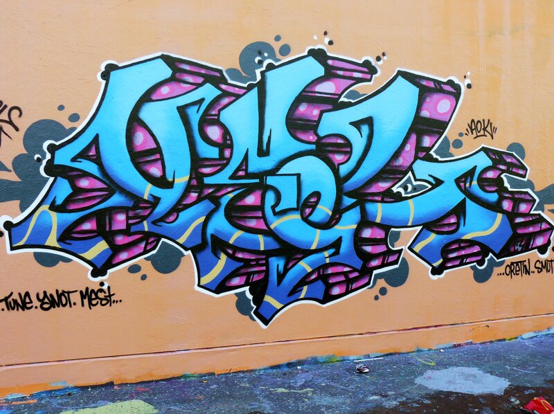 colorful graffiti on orange wall
