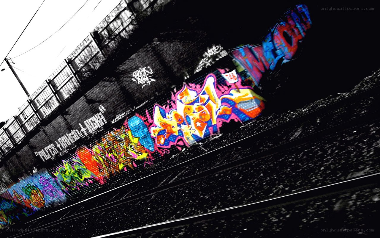 colorful graffiti on train tracks