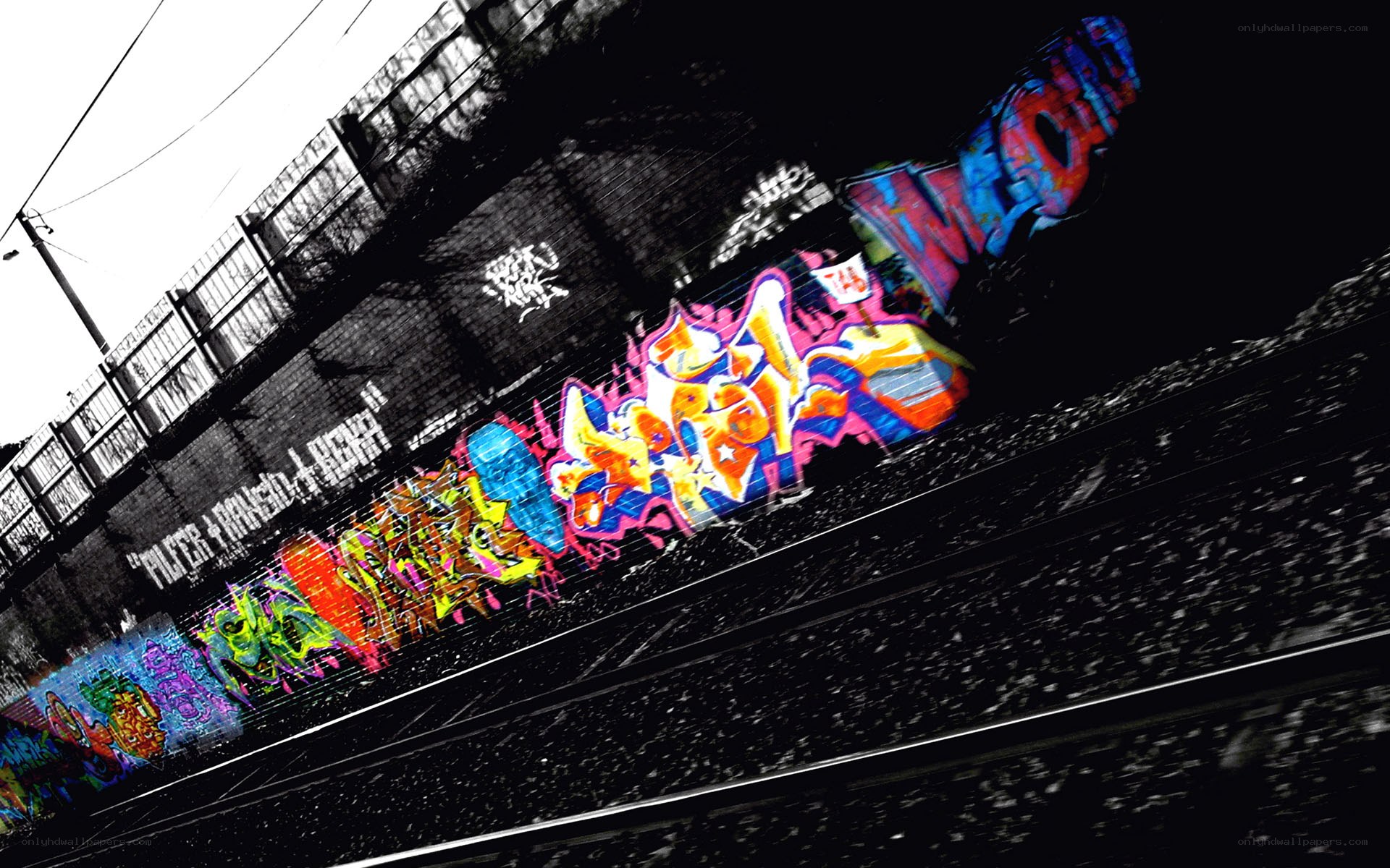 colorful graffiti on train tracks