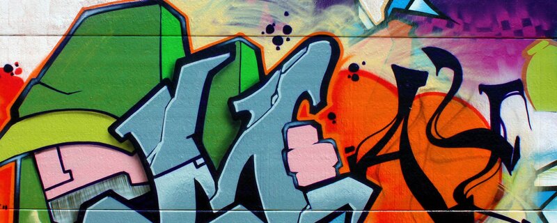 Colorful Graffiti on Wall — Green, Vibrant, Spray Paint