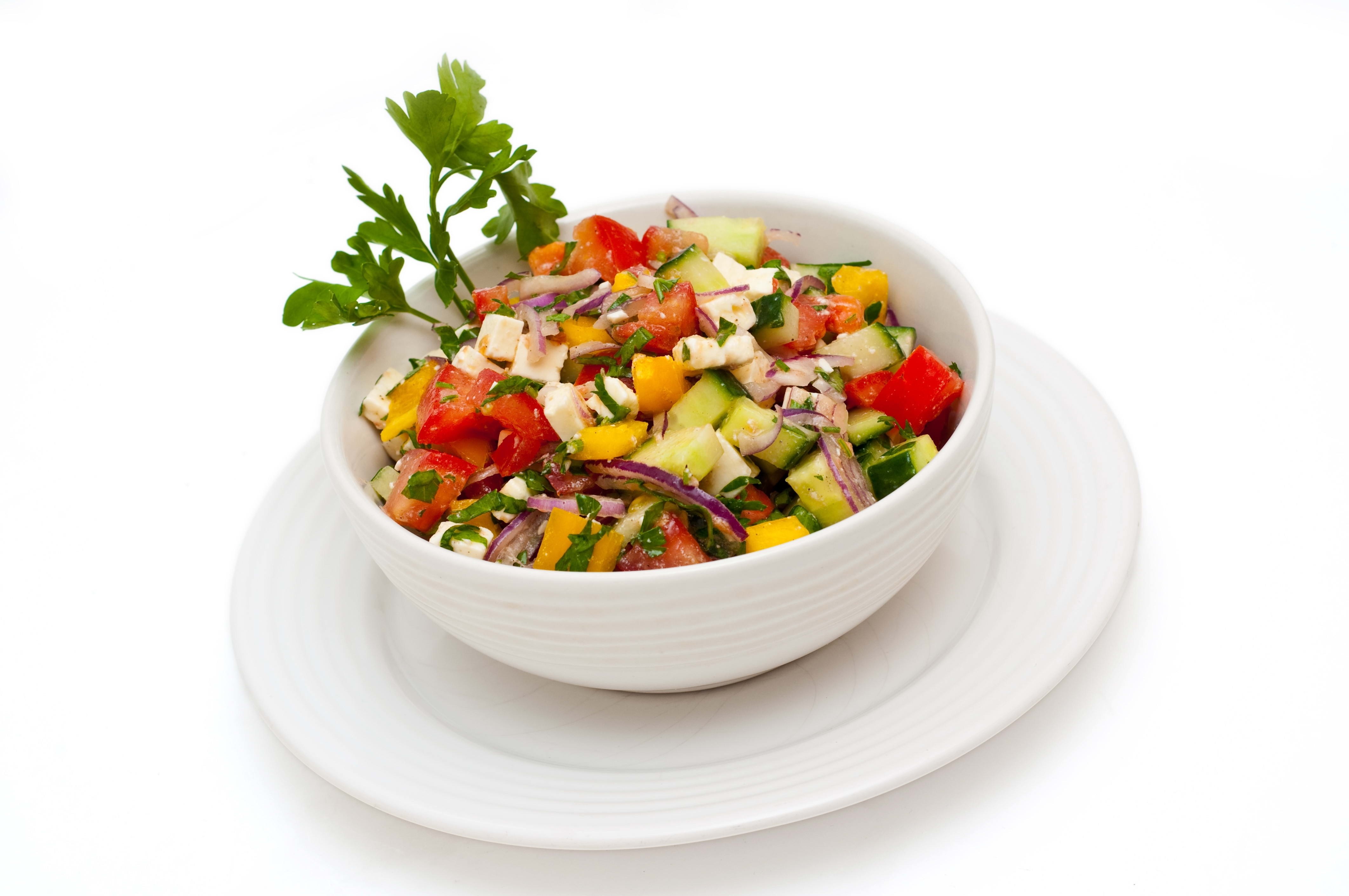 colorful greek salad in bowl