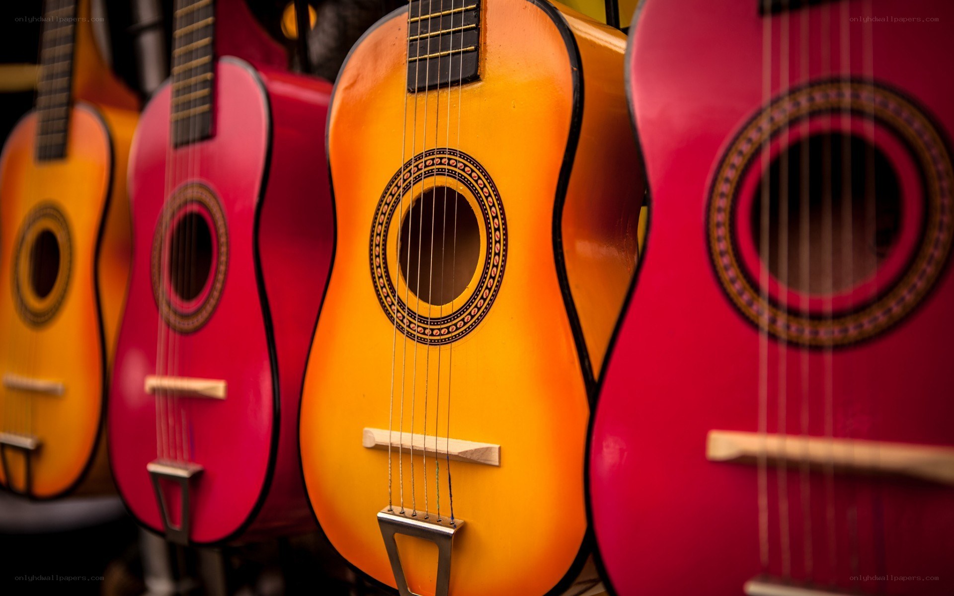 Colorful guitars in a row