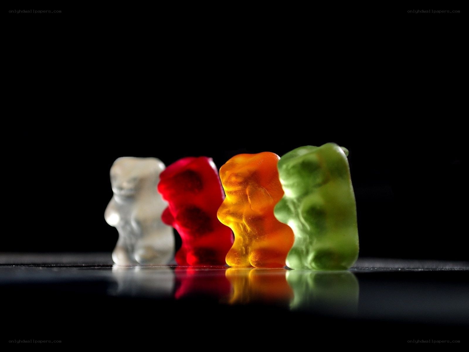 Colorful gummy bears in a row