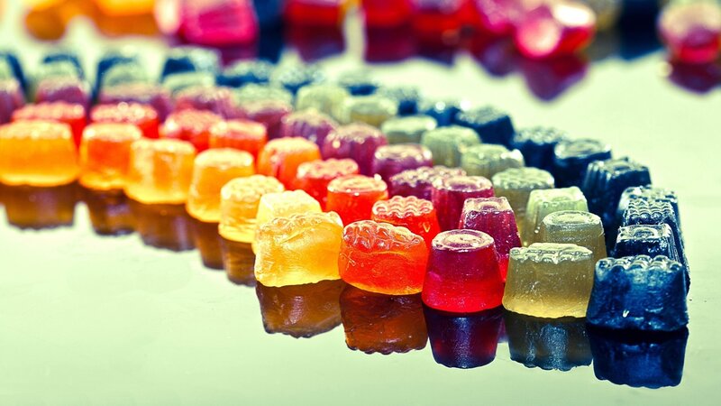 Colorful Gummy Candies — Red, Vibrant, Photograph, Reflection, Table