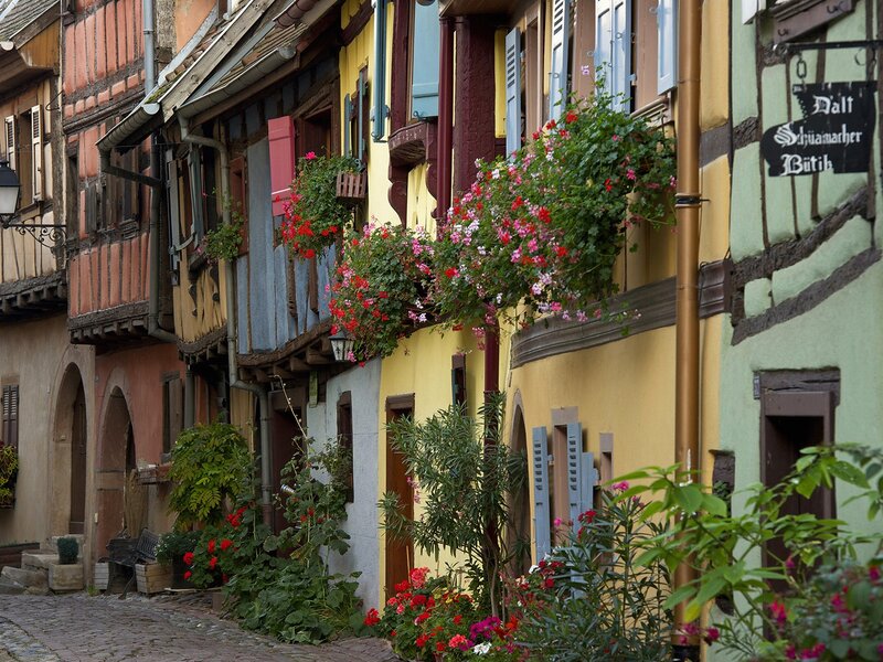 colorful half-timbered houses in a narrow street