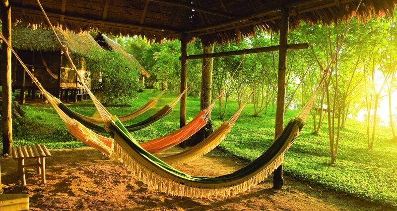 Colorful Hammocks under Hut