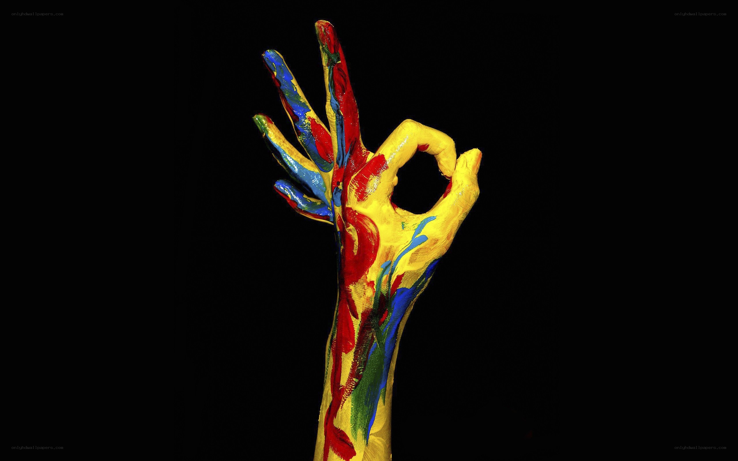 colorful hand making okay gesture