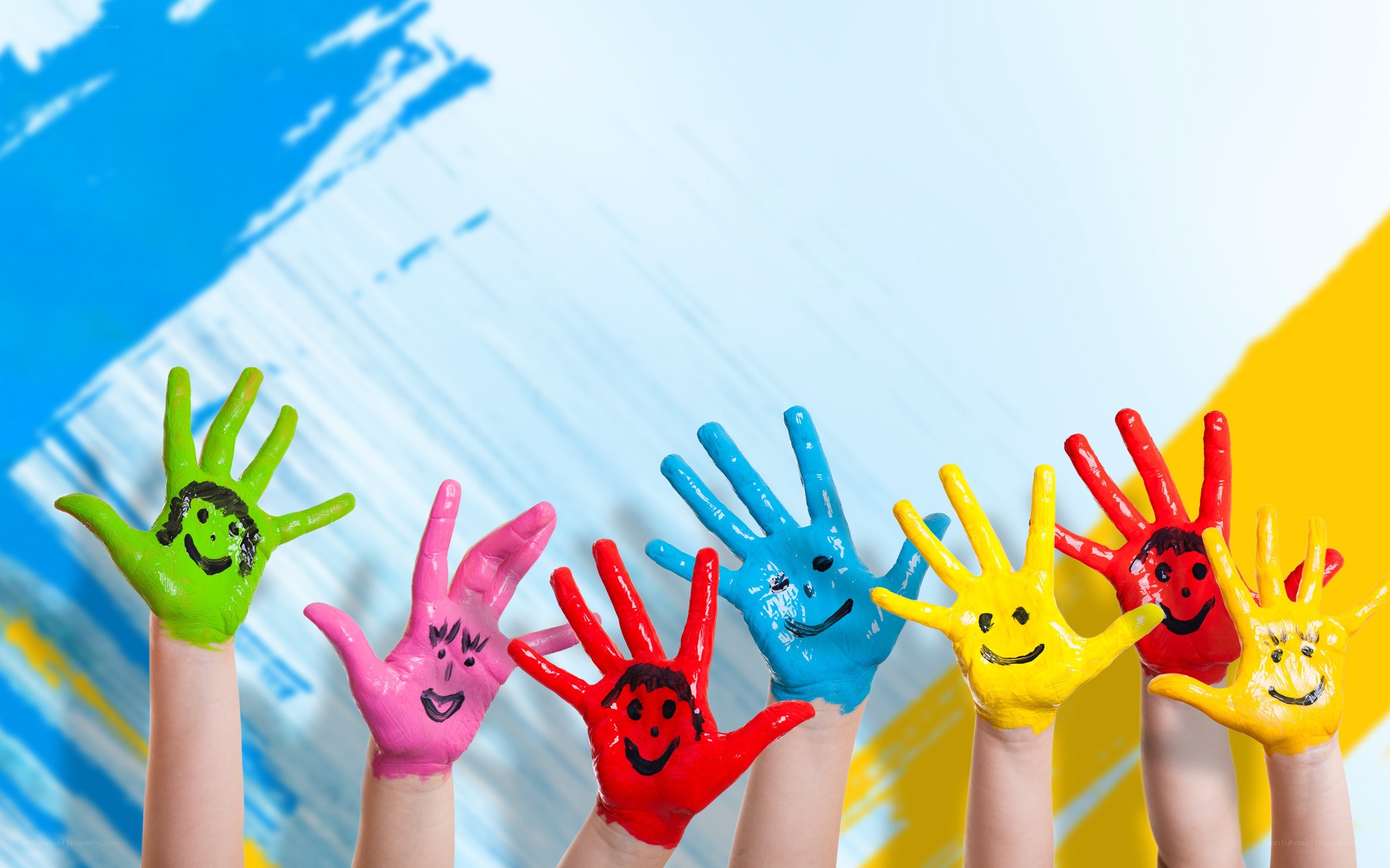 colorful handprints with smiley faces