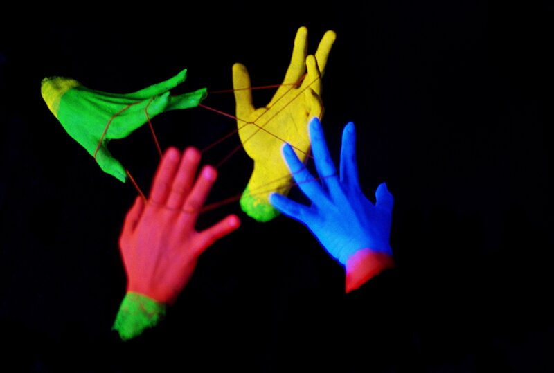 colorful hands with string art