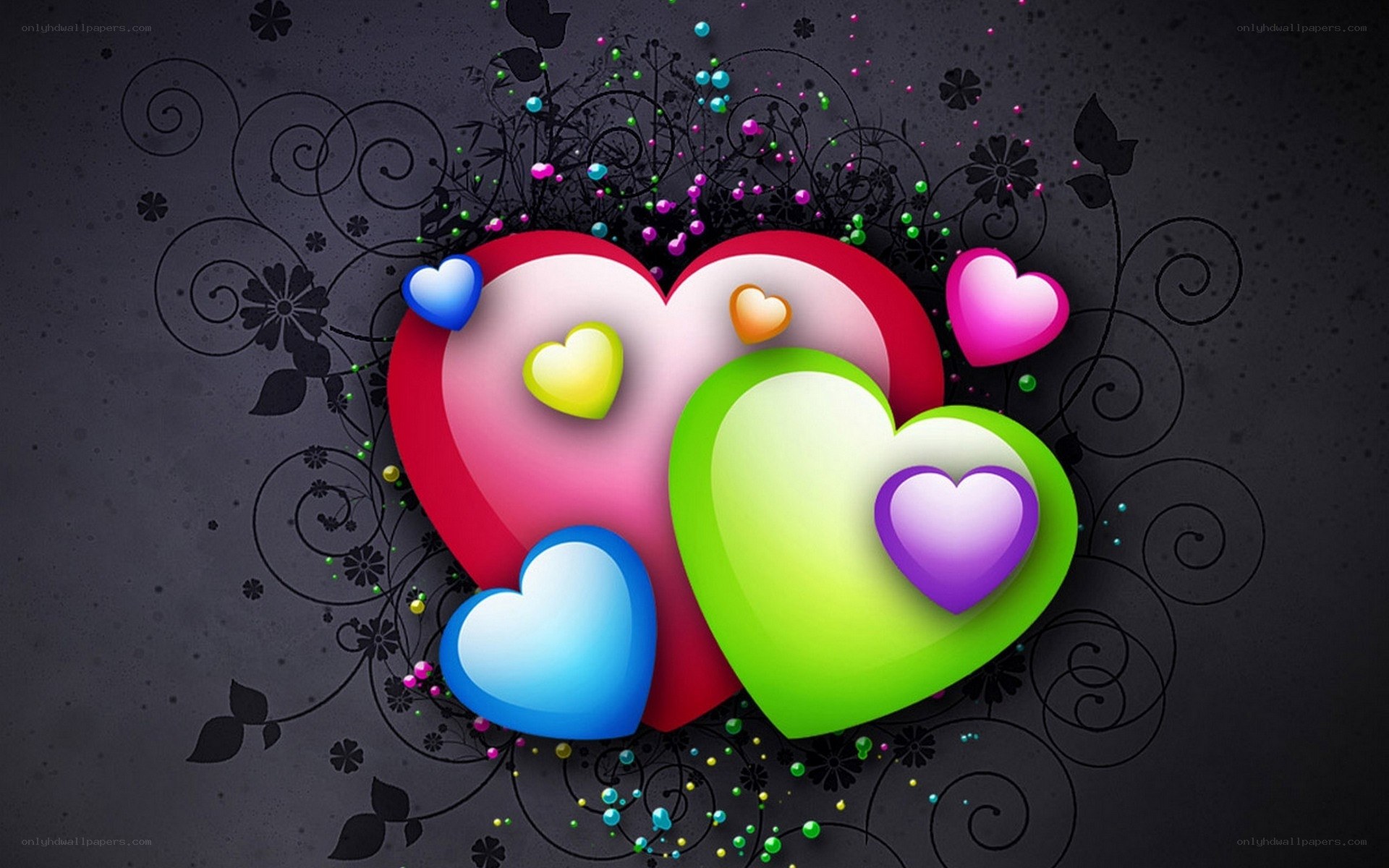 Colorful hearts on dark background