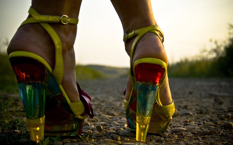colorful high heels on gravel