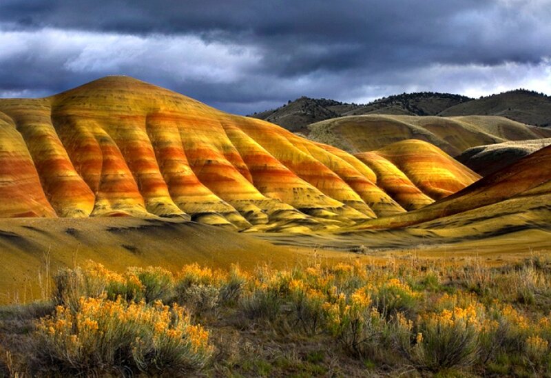 Colorful hills under stormy sky