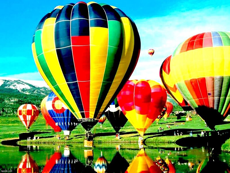 Colorful hot air balloons at lake