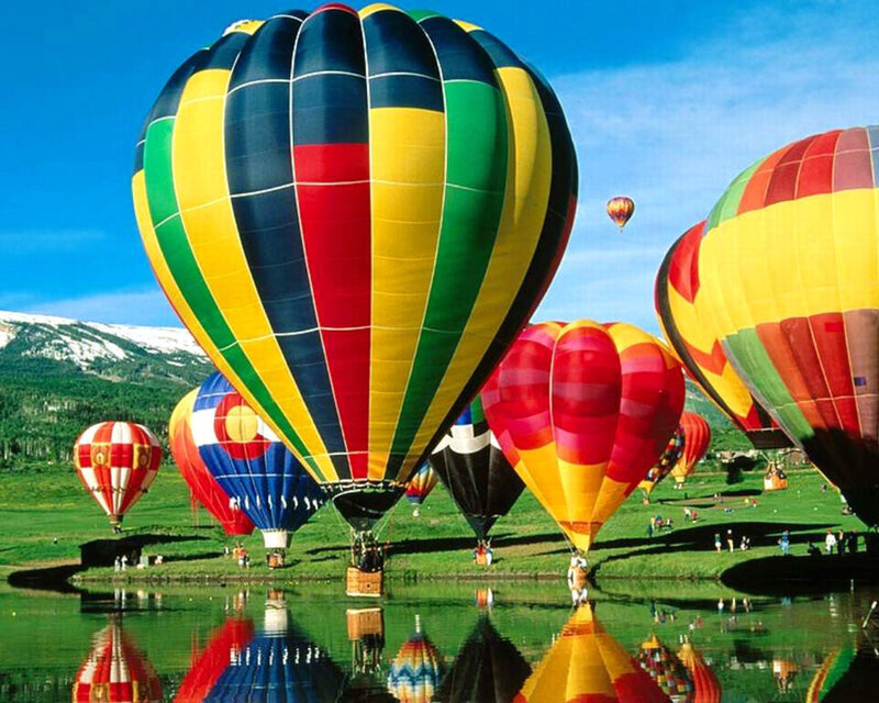 Colorful hot air balloons at sunrise