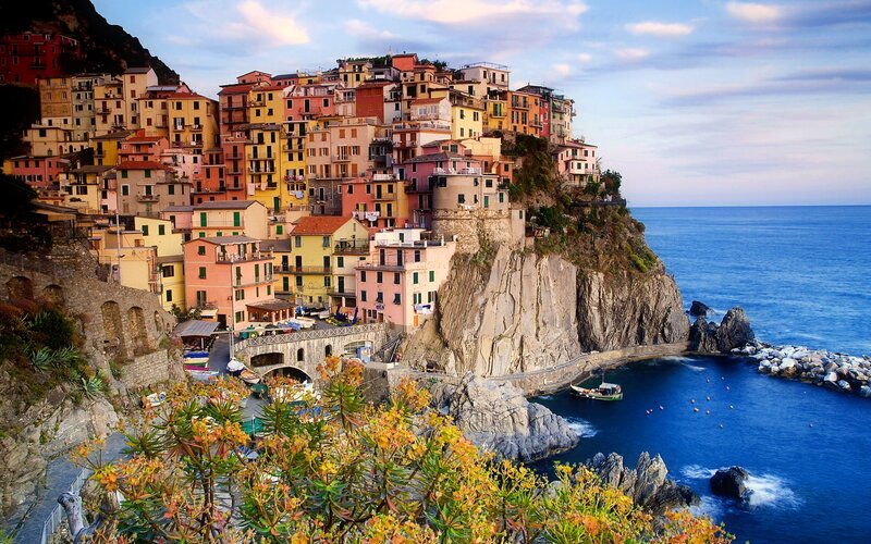 Colorful Houses on Cliff — Blue, Serene, Sunset, Photograph