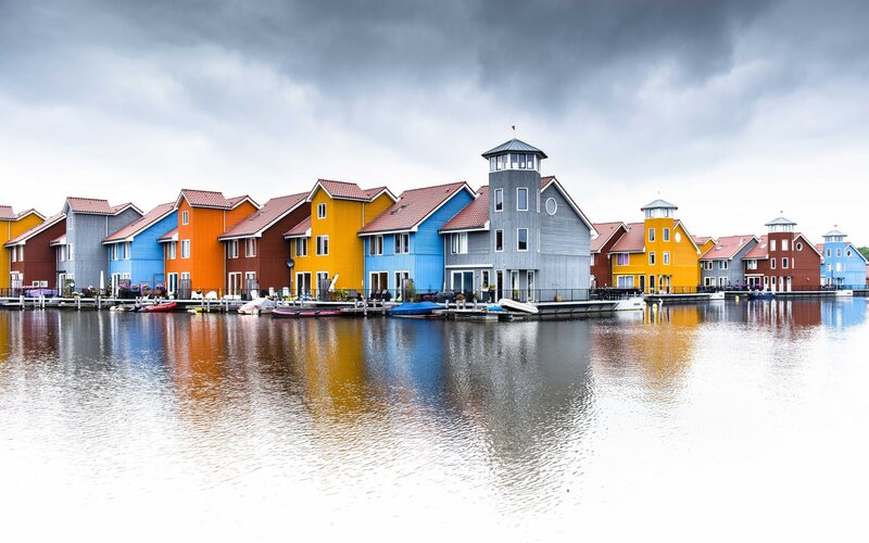 Colorful Houses on Water — Blue, Dramatic