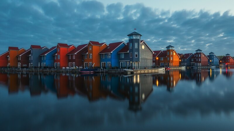 Colorful Houses on Water — Blue, Serene, Sunset, Photograph, Sky, Reflection