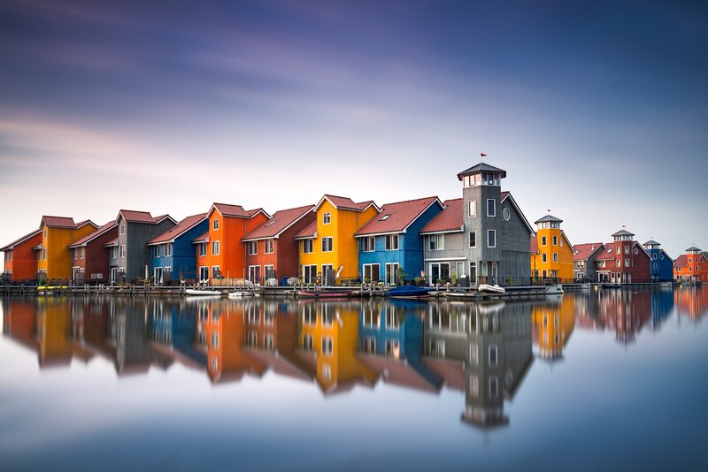 Colorful Houses on Water — Blue, Serene, Sunset, Photograph