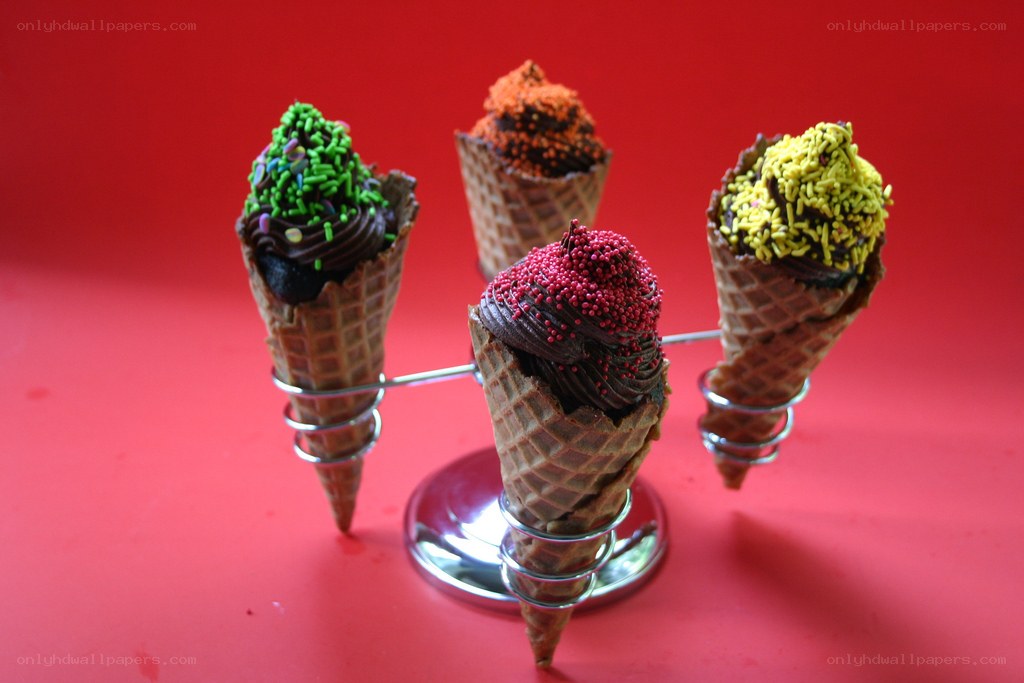 Colorful ice cream cones on stand