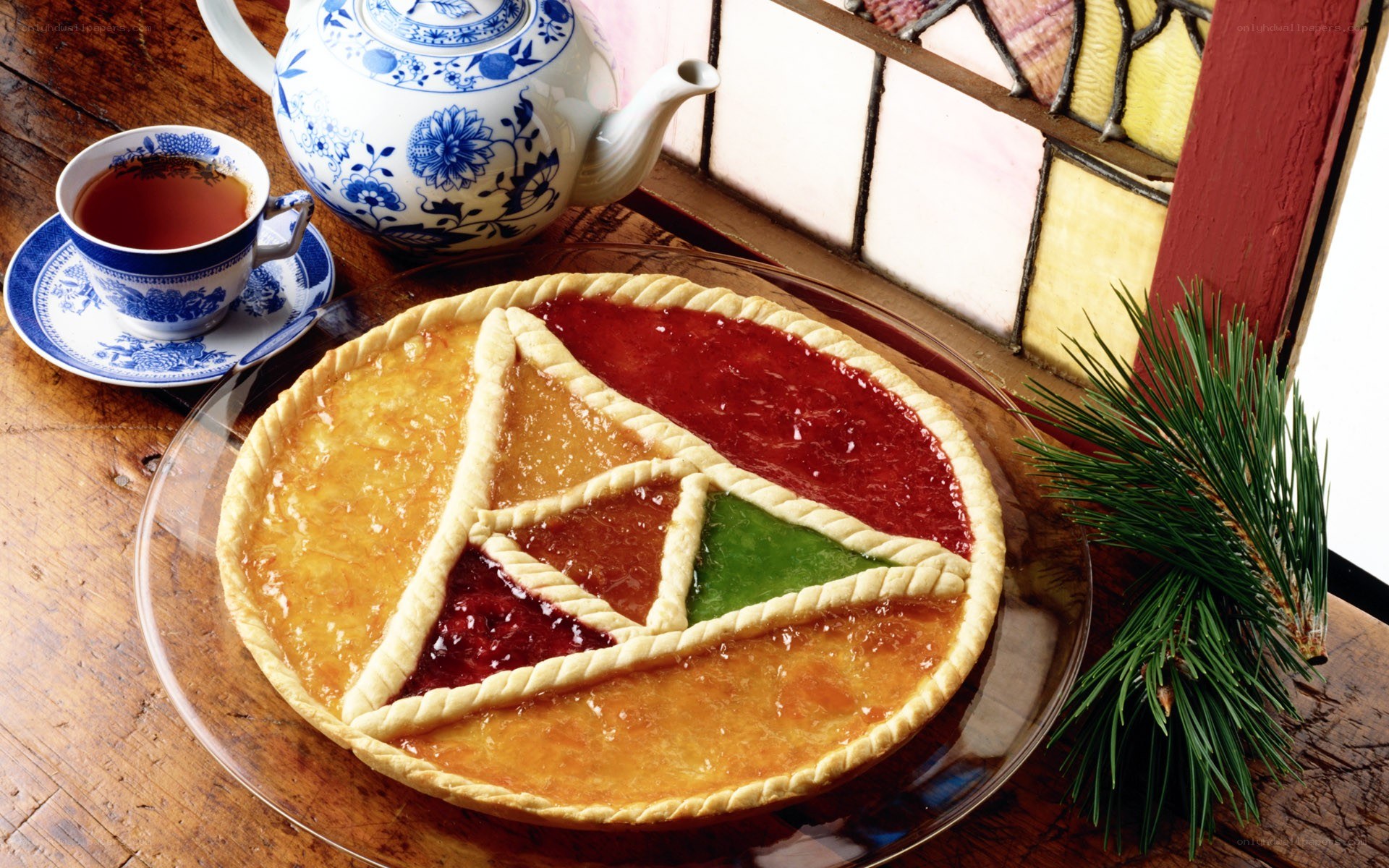 Colorful jam pie with tea