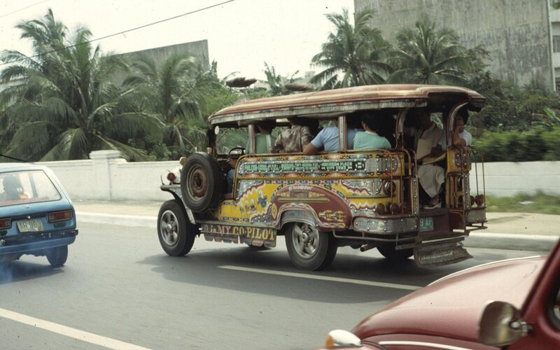 Colorful jeepney on a tropical road