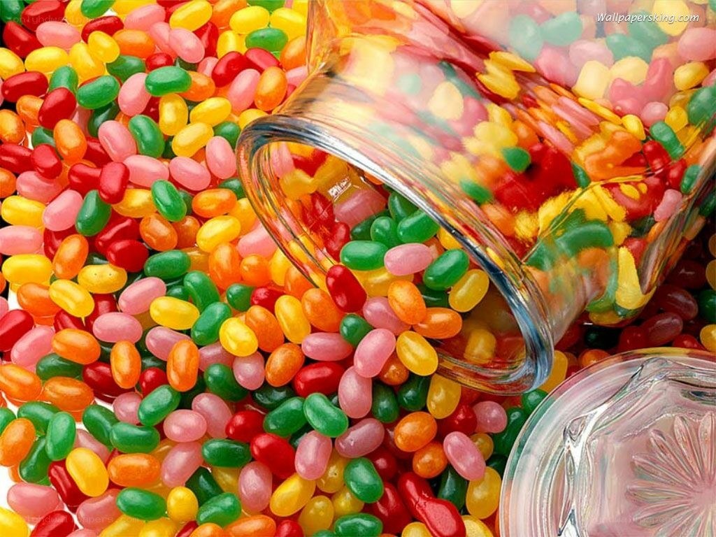 Colorful jelly beans spilling from jar