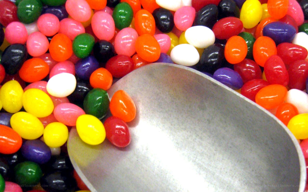 Colorful jelly beans with a scoop