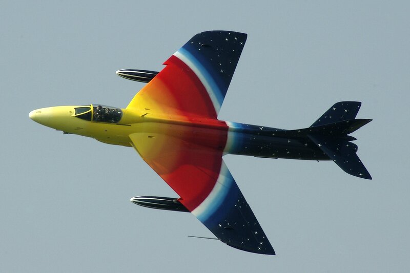 colorful jet in flight