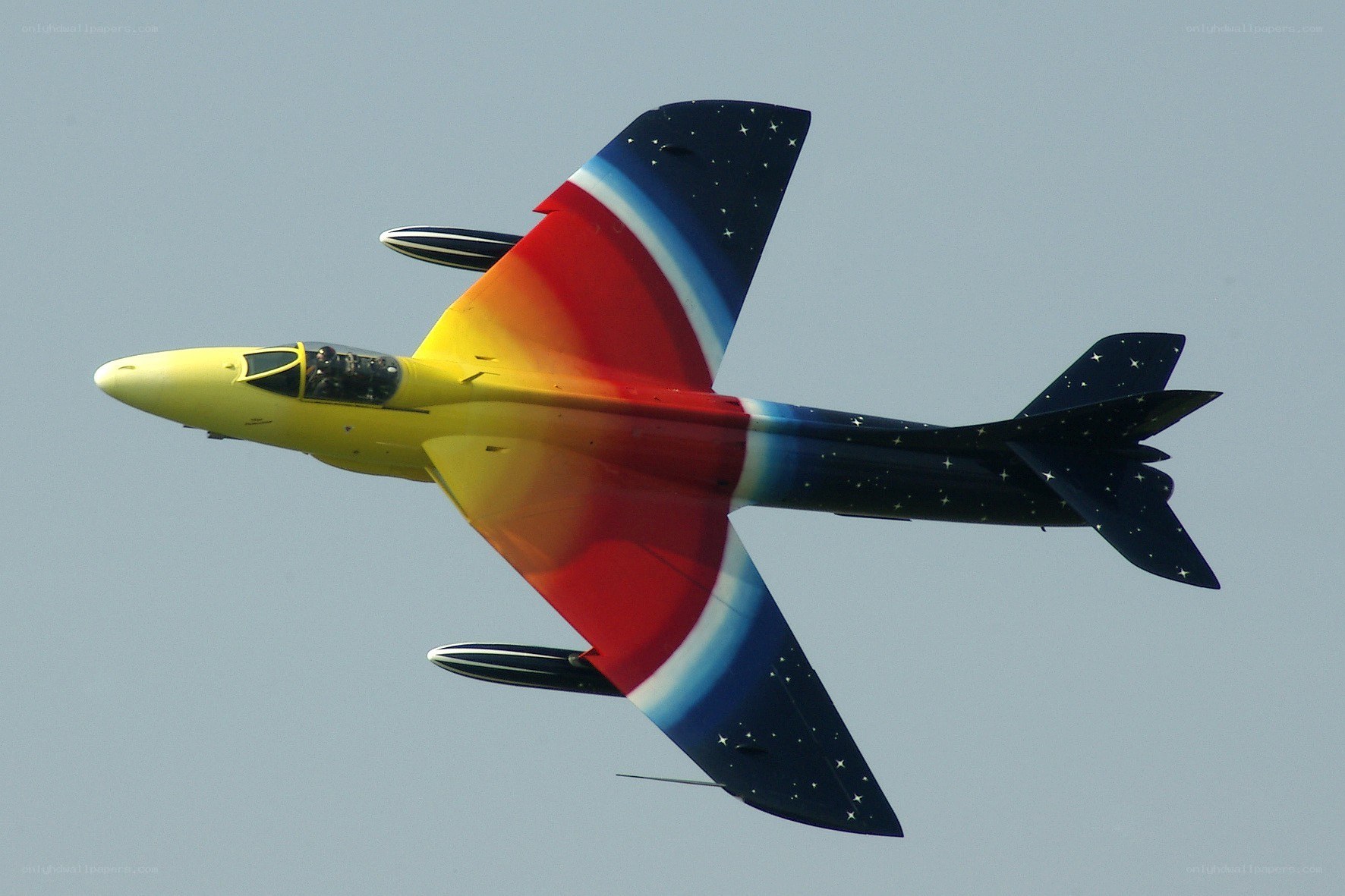colorful jet in flight