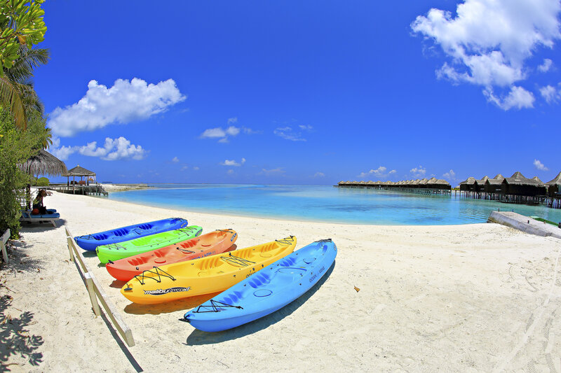 Colorful Kayaks on Beach — Blue, Serene, Afternoon, Photograph, Ocean