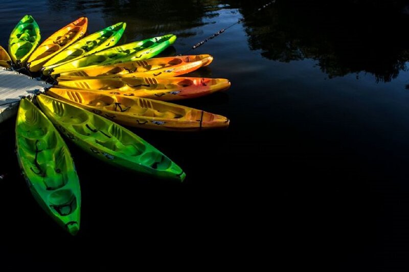 Colorful Kayaks on Water