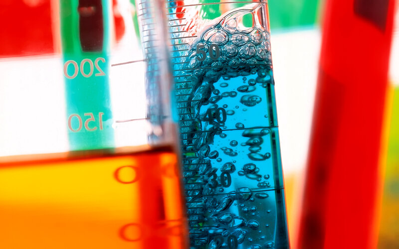 Colorful lab liquids in beakers