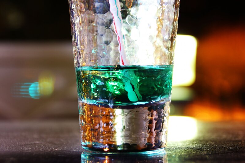 Colorful layered drink in glass
