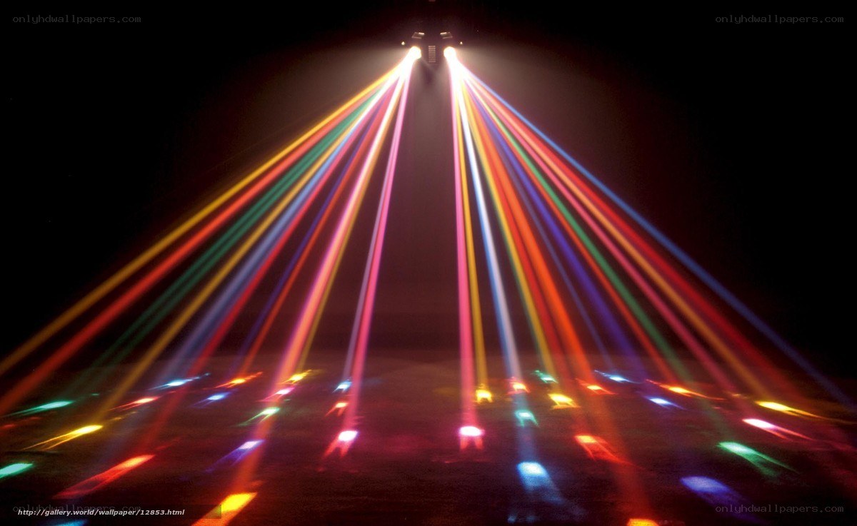 Colorful light beams in dark room