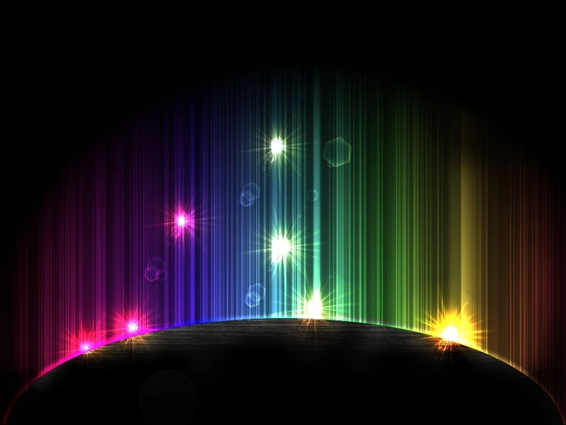 colorful light beams on dark background