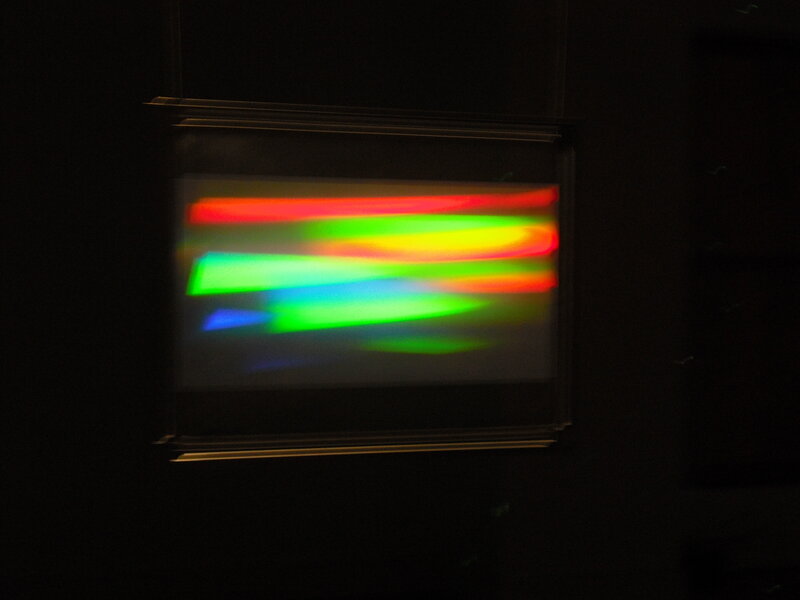 Colorful light patterns in dark room