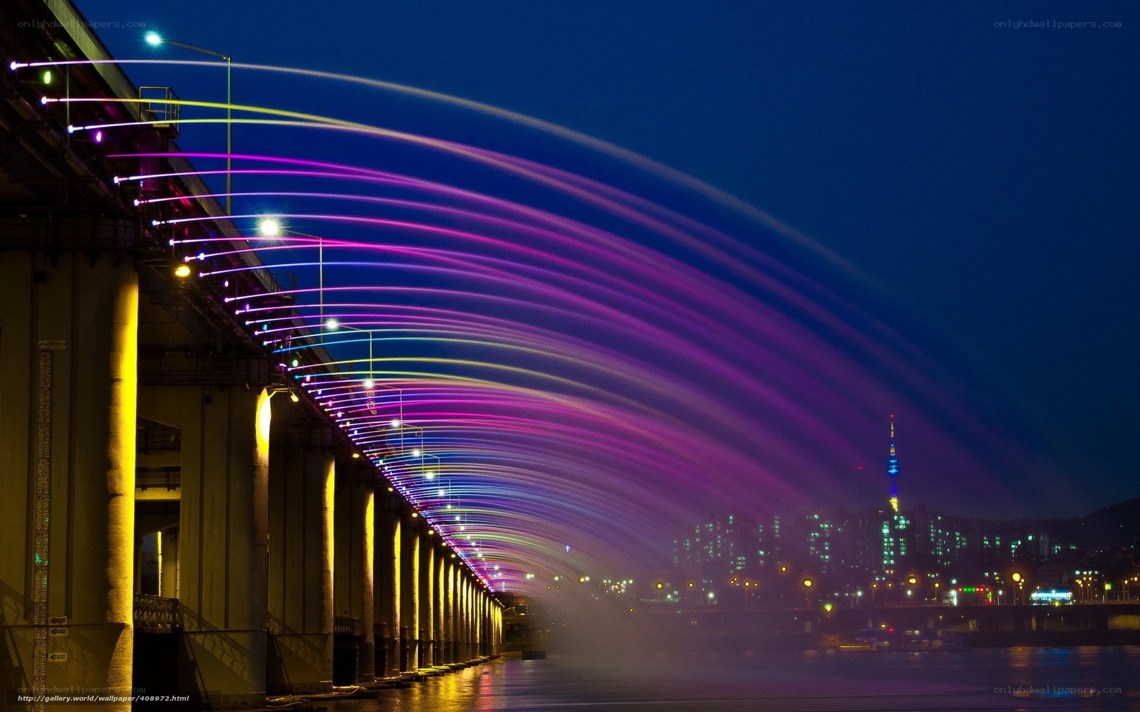 Colorful light show over a bridge