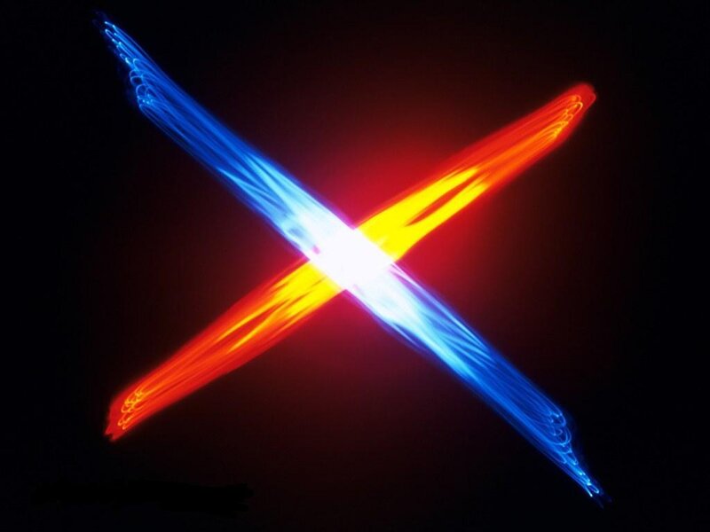 colorful light trails forming an X